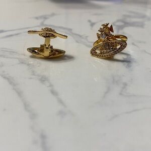 Gold Vivienne Westwood Orb inspired clasp earrings.